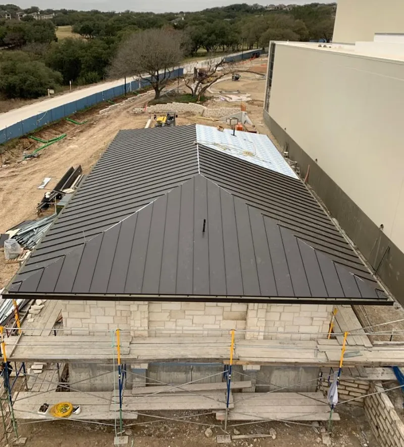 Metal roof new construction with scaffolding in Franklin